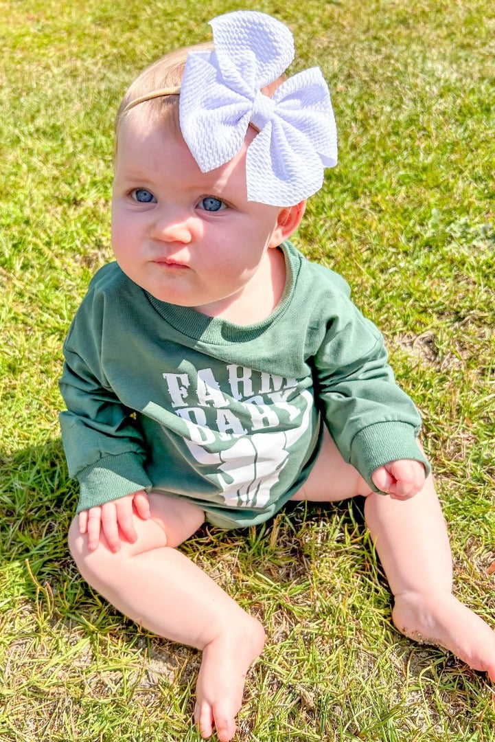 Girls' Farm Baby Bubble in dark green with long sleeves, featuring the words 'Farm Baby' and a cattle skull design.