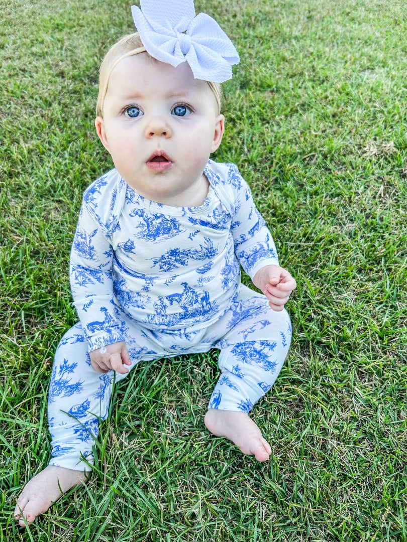 Girls' Vintage Baby Onesie with a blue and white 'Blue Willow' inspired print.