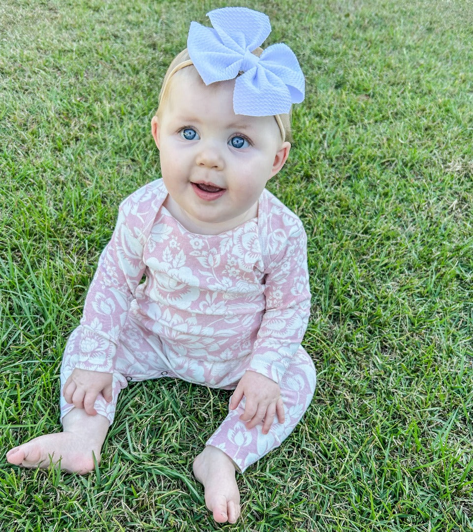 Girls' Vintage Rose Onesie featuring rose designs and a beautiful dusty rose hue..
